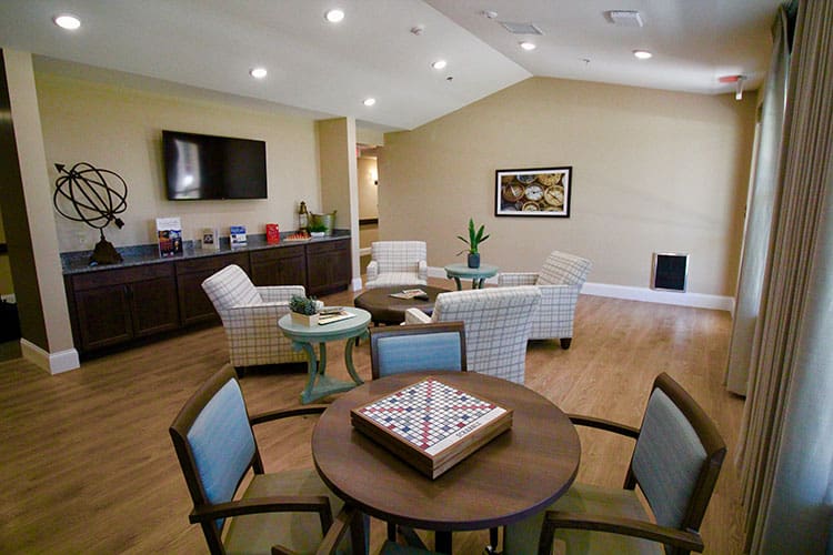 Charter Senior Living of Oak Openings, IL activity room with board game set up on a table