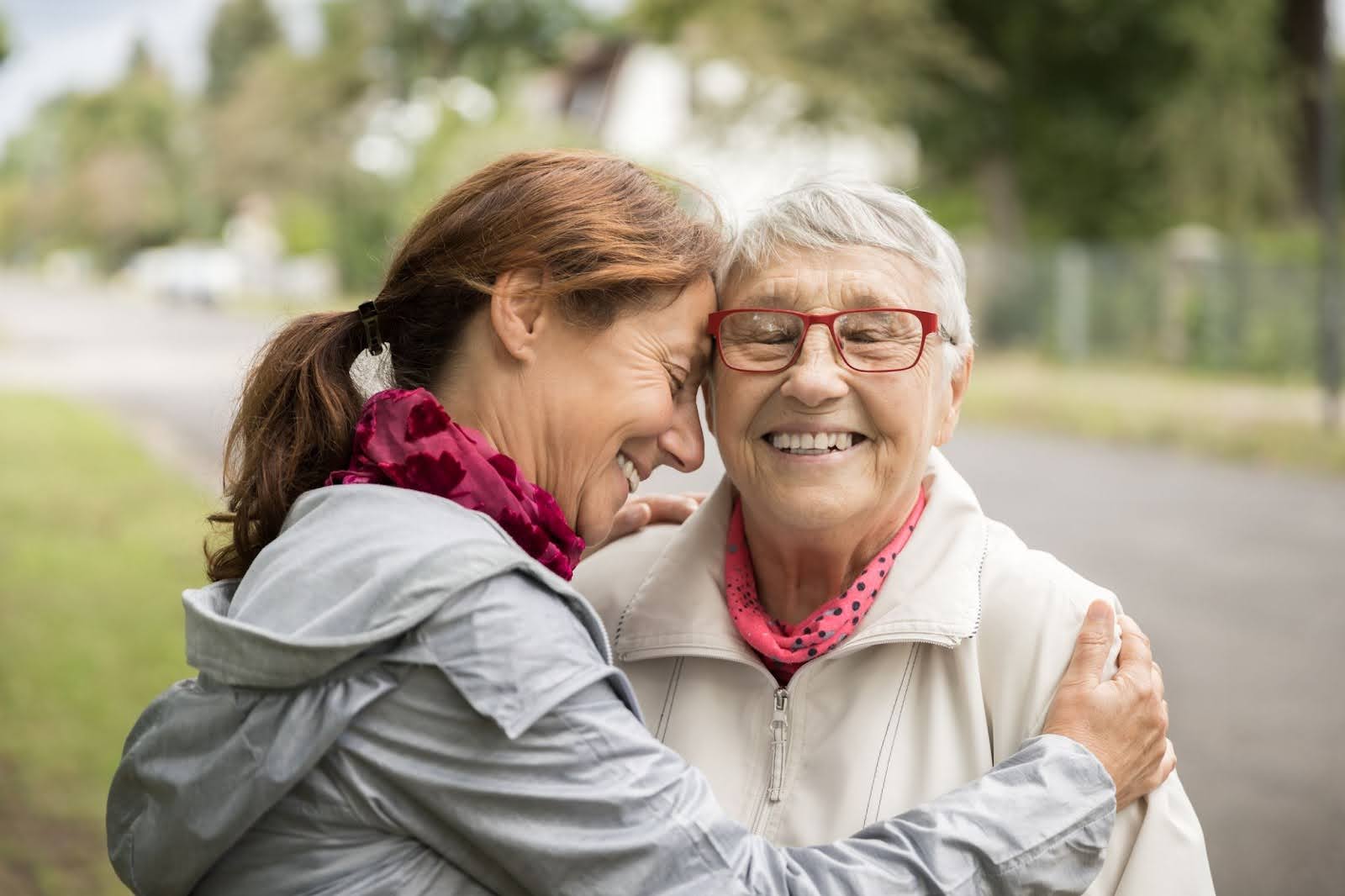 senior hugging family member